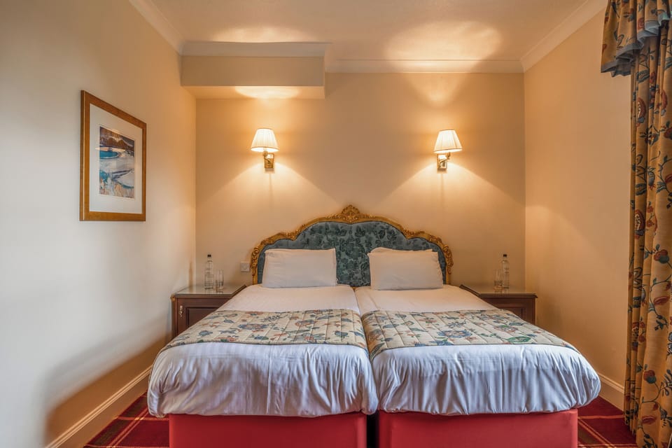 Sink into plush twin beds with boutique-hotel comfort.