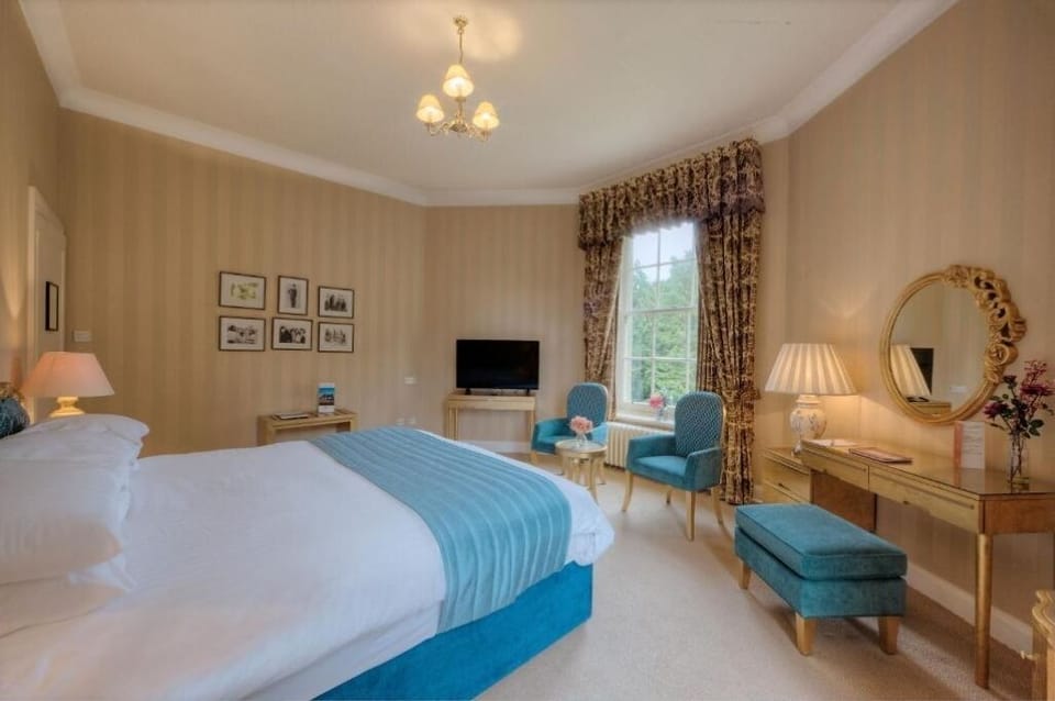 Settle into plush bedding and elegant seating by sunny windows.