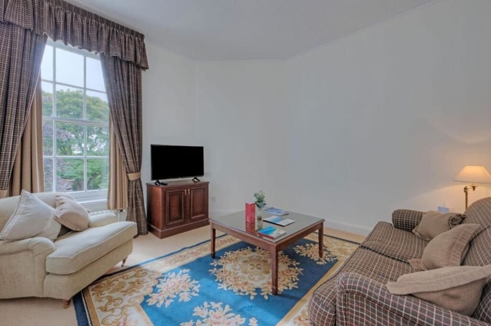 Stretch out in the bright lounge with sofas and peaceful views.