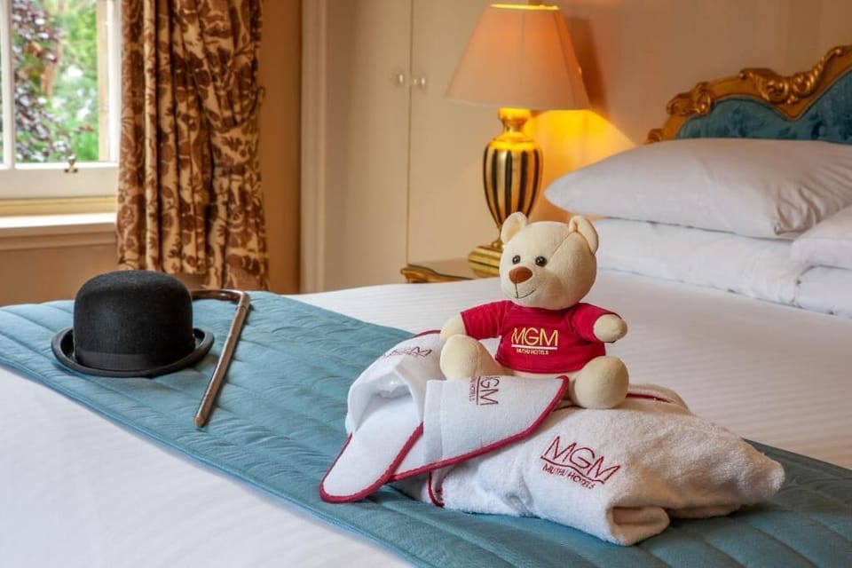 Feel pampered with fresh towels and cozy, welcoming bed styling.
