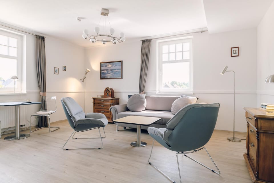 Bright Living Room with Sofa and Chairs