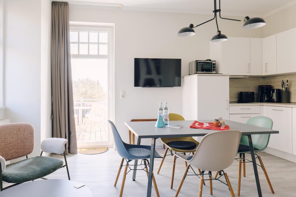 Modern Kitchen with Dining Area and TV