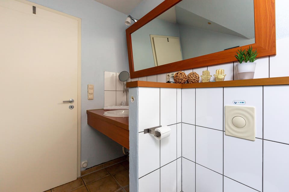 Bright Bathroom with Wooden Sink and Mirror