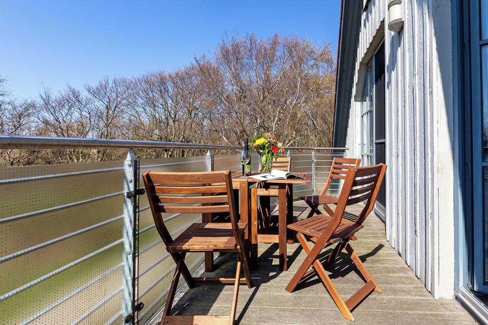 Balcony with table and chairs