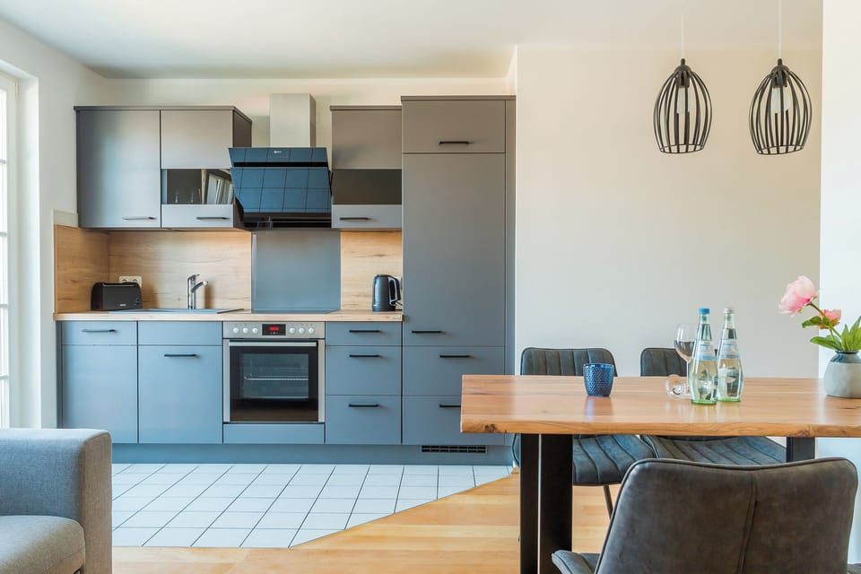 Modern kitchen with dining table and appliances