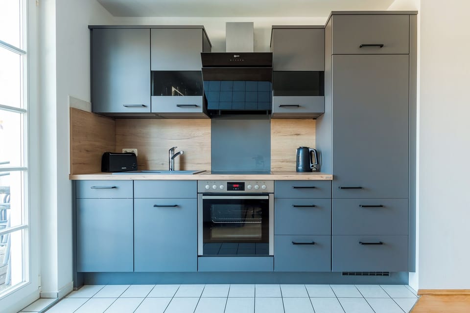 Modern Kitchen with Dark Cabinets and Stove