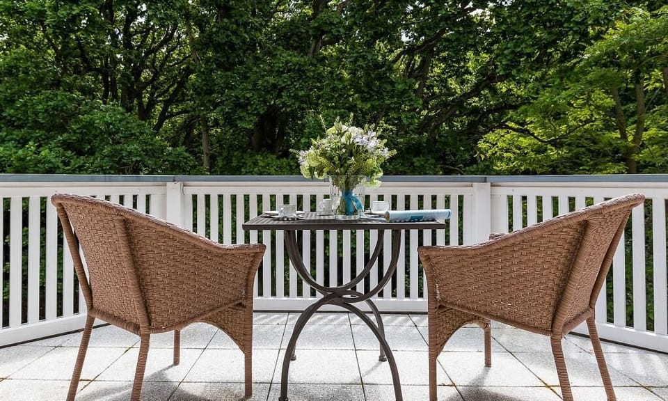 Terrace with Rattan Chairs and Table
