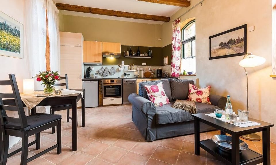 Inviting Living Room with Sofa and Kitchen