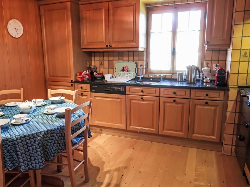Kitchen, Cabinetry, Kitchen Appliance, Countertop, Wood, Furniture, Flooring, Interior Design, Major Appliance, Cupboard
