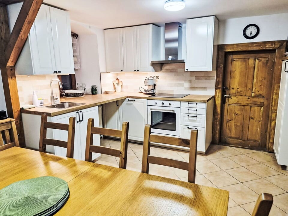 Furniture, Wood, Kitchen, Interior Design, Cabinetry, Flooring, Countertop, Ceiling, Room, Floor