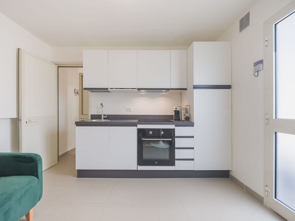 Interior Design, Flooring, Kitchen, Countertop, Kitchen Appliance, Cabinetry, Floor, Major Appliance, Wood, Furniture
