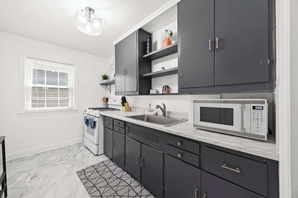 Kitchen: Unit 1 - Cook with ease in this functional kitchen featuring updated appliances and essentials.