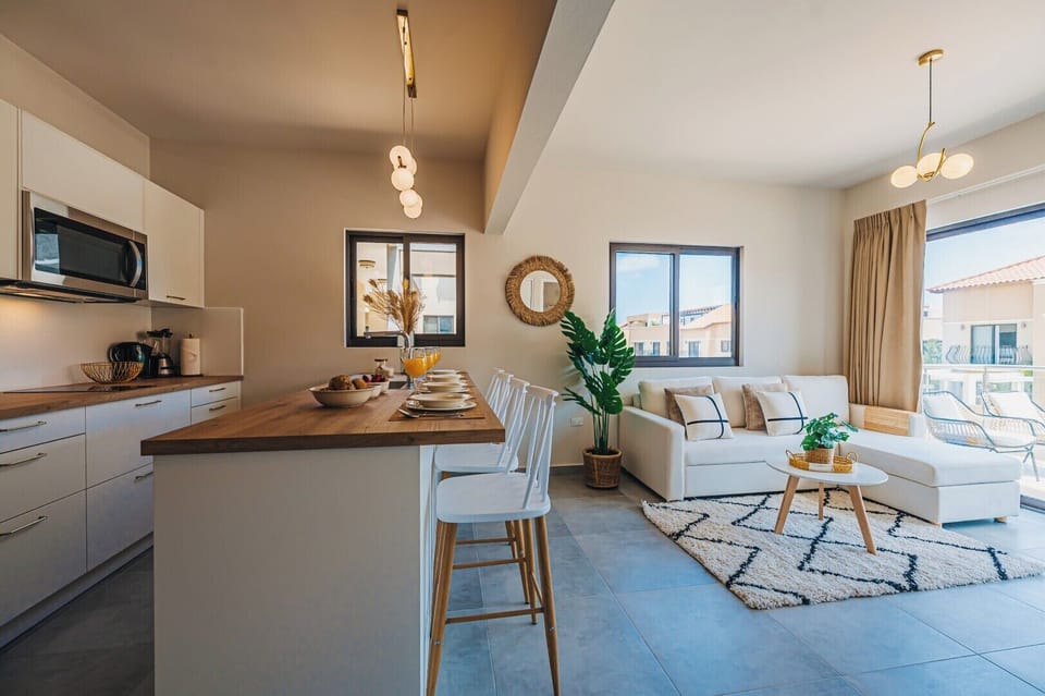 Seamless flow between kitchen and living room—bright, inviting, and perfect for laid-back mornings or evening catch-ups.

