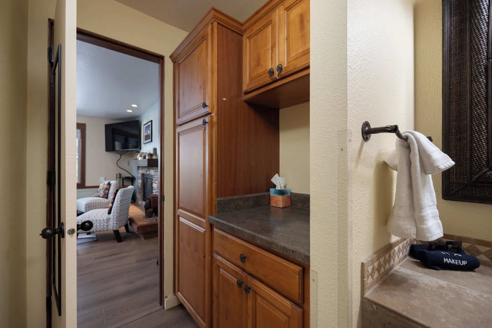 Wash up in the full bath, offering a single vanity & glass shower