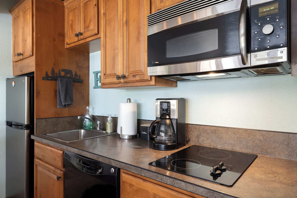The inviting open kitchen offers ample space & all the comforts of home