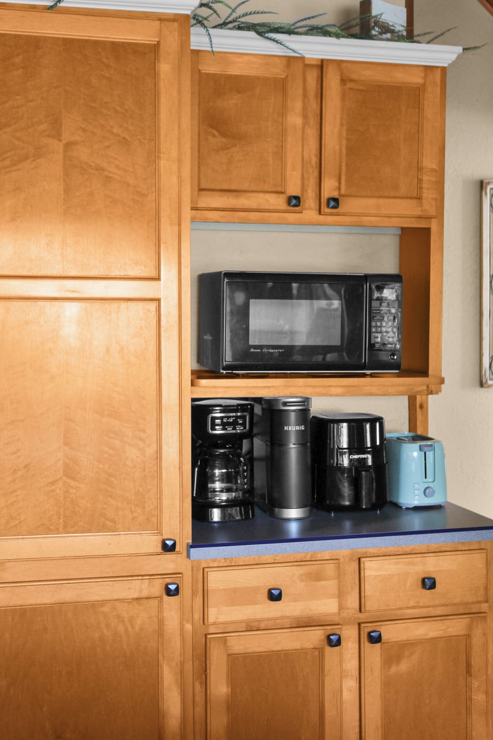Plenty of dishes, plus microwave, drip coffee maker, Keurig, air fryer, toaster