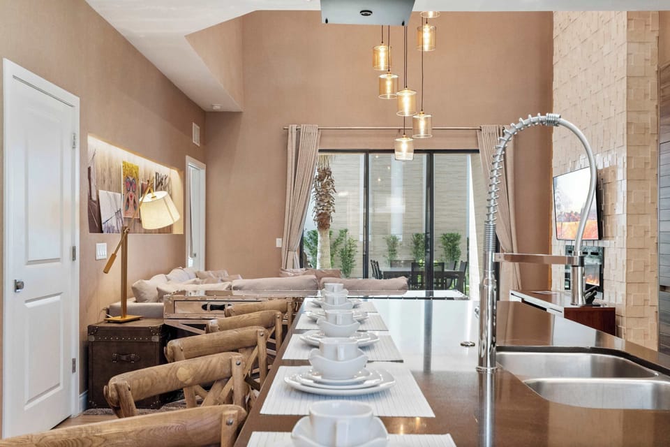 Spacious gourmet kitchen with large island, modern appliances, and open layout.