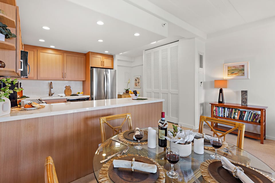 Your open-concept kitchen and dining area invites you to enjoy home-cooked meals in bright, welcoming style, with modern appliances and warm wood tones throughout.