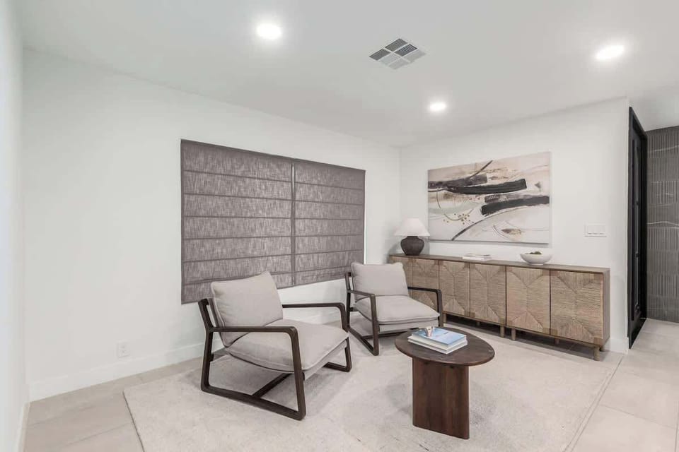 Relax in the spacious living room with cozy seating and a smart TV.