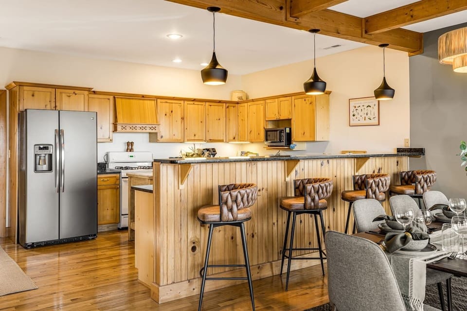 beautiful dining room, with brand new bar stools and light fixtures