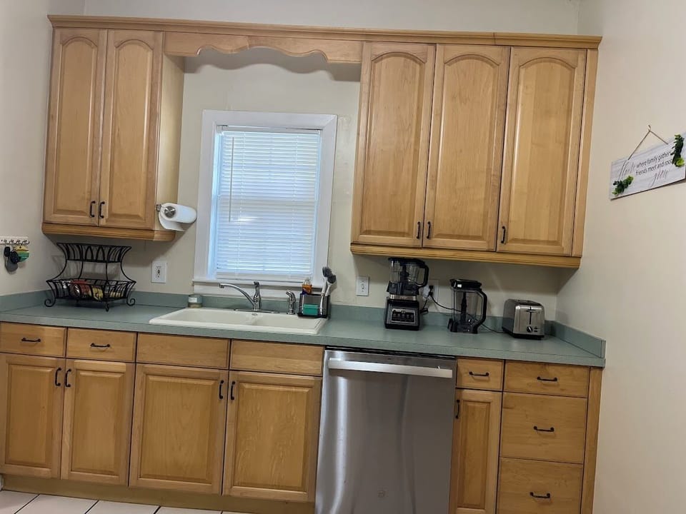 Full kitchen with dishwasher, toaster, coffee maker, and many more