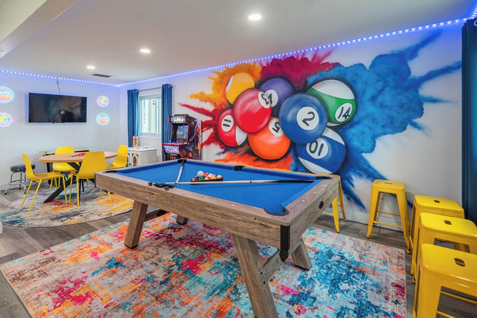Game Room Fun featuring arcade video games, pool table and board games