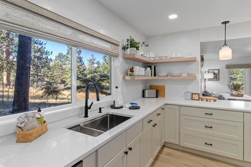 Open kitchen with scenic forest views
