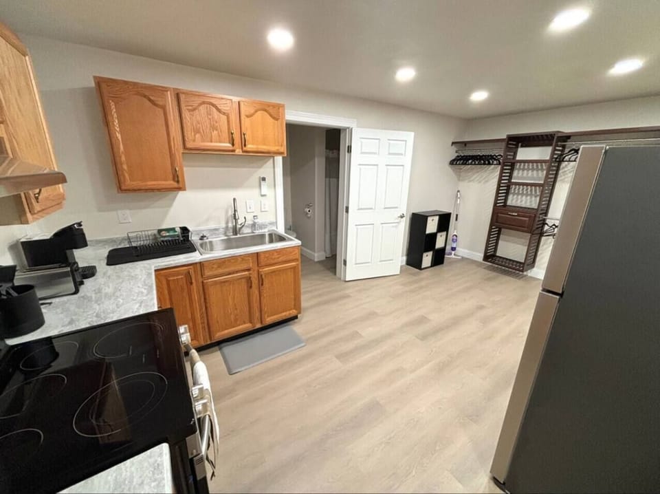 The large eat in kitchen adjoins to the cozy bedroom area. There is ample clothing storage. 