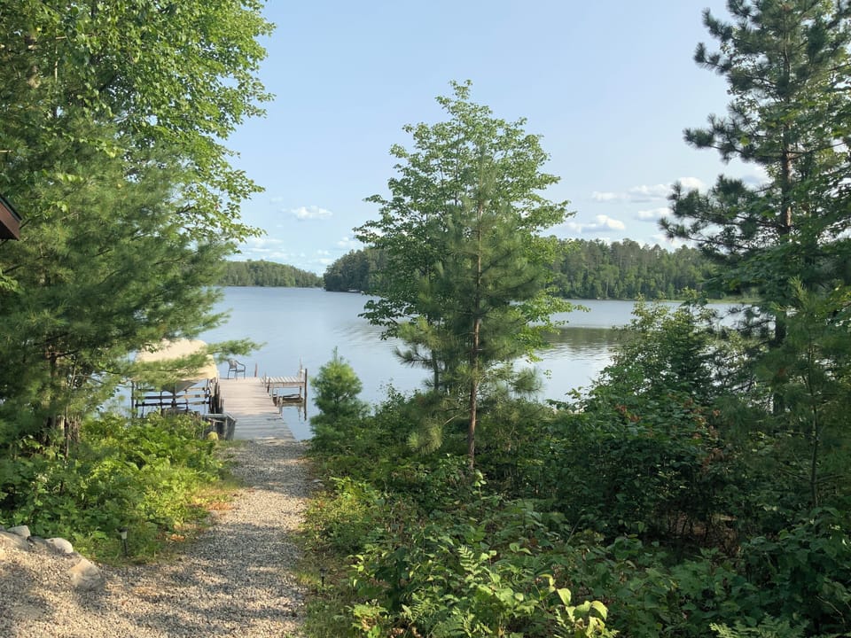 Gentle sloping path between the lake and cabin 