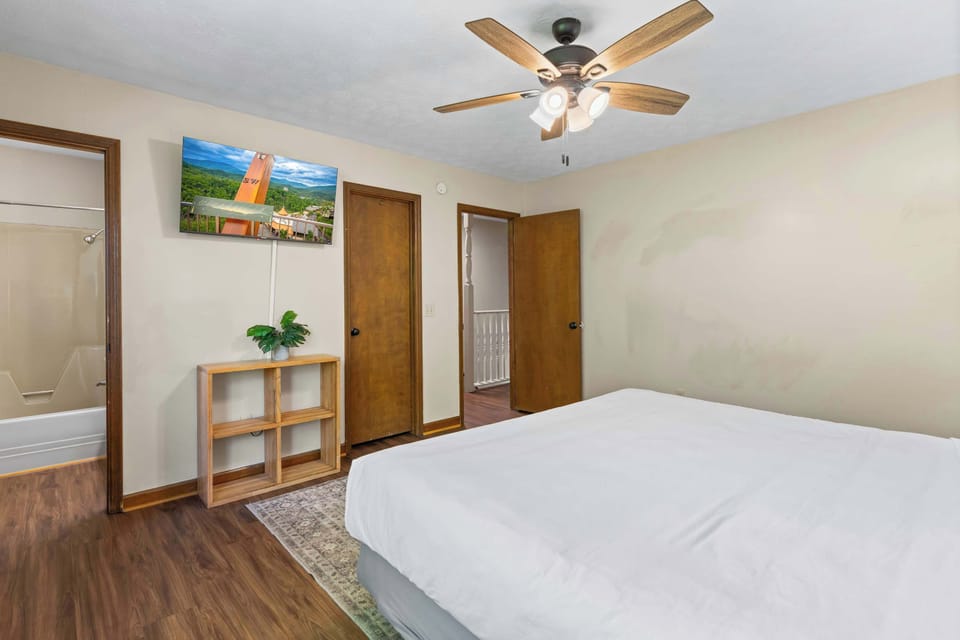 Sink into soft, cloud-like pillows, unwind in a spacious and cozy setting, and enjoy your favorite shows on a Smart Roku TV, perfect for a relaxing evening after exploring Pigeon Forge and Gatlinburg.
