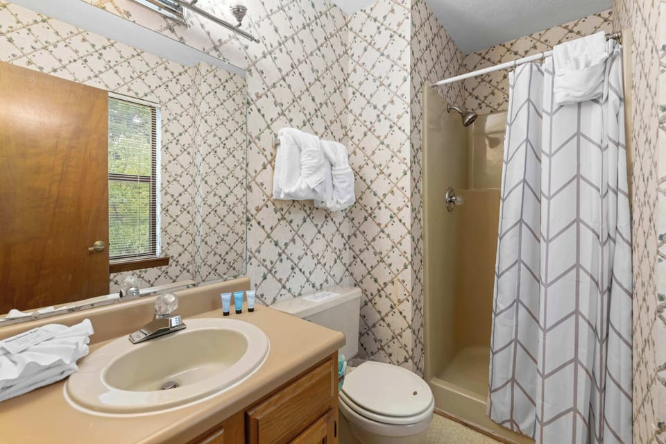 Refresh in this charming bathroom with rustic decor and natural light!