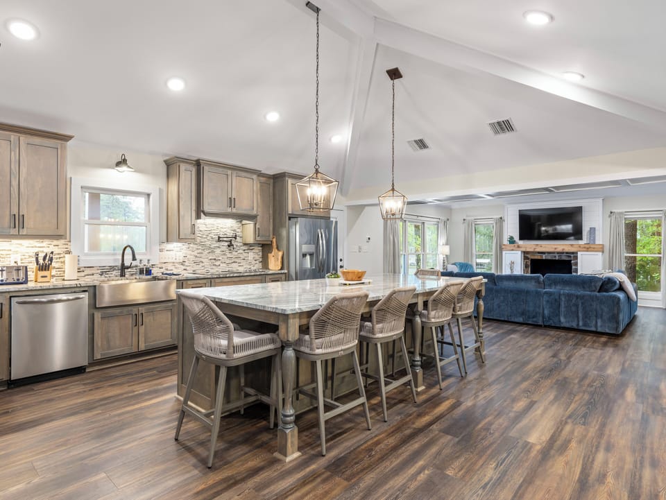 The kitchen and great room make for the perfect gathering area for large groups. The kitchen is fully equipped and has 2 ovens to accomodate cooking for lots of folks