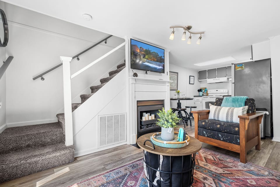 Living room with fireplace and queen sleeper sofa