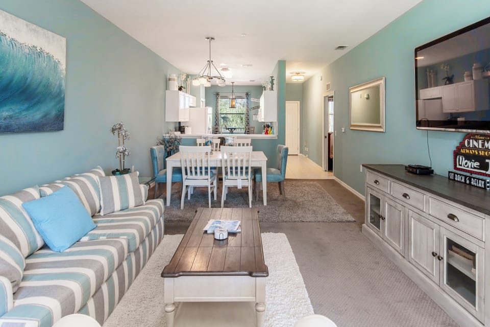 Smart TV, dining table seats 6, plenty of living room seating.