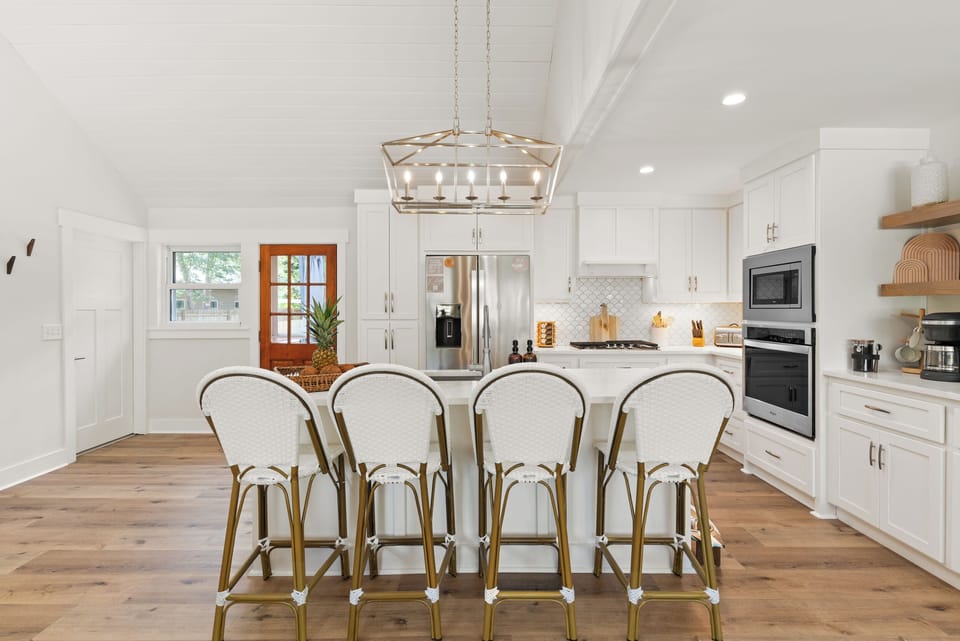Huge island with bar seating with fully- equipped kitchen & coffee bar