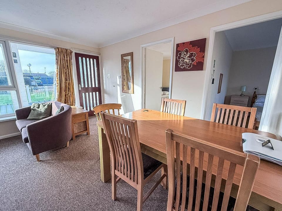Imagine enjoying breakfast in the bright and airy dining room of your holiday home, surrounded by the beauty of the holiday park