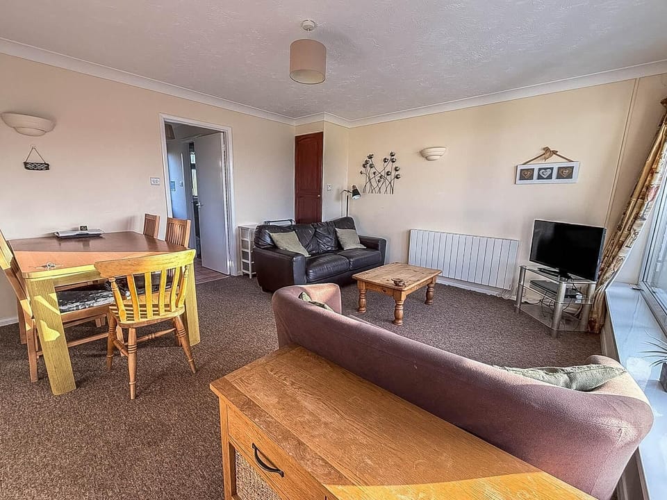 The living room in our cosy holiday home is the perfect spot to unwind after a day of exploring