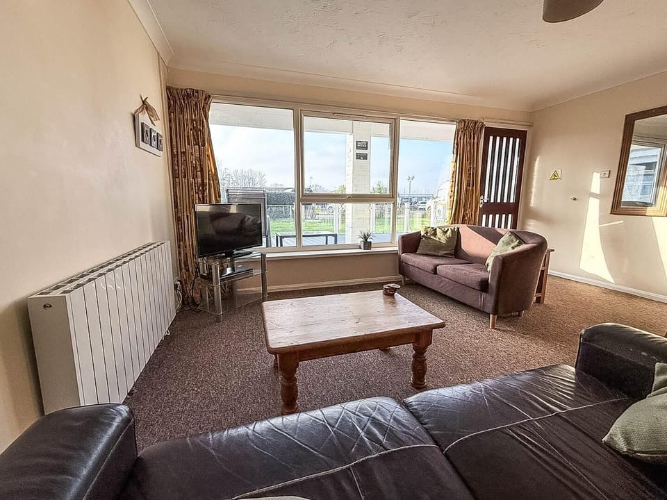 The living room in our cosy holiday home is the perfect spot to unwind after a day of exploring