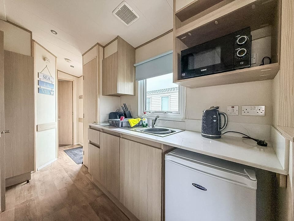 Bright, modern kitchen with ample natural light and storage