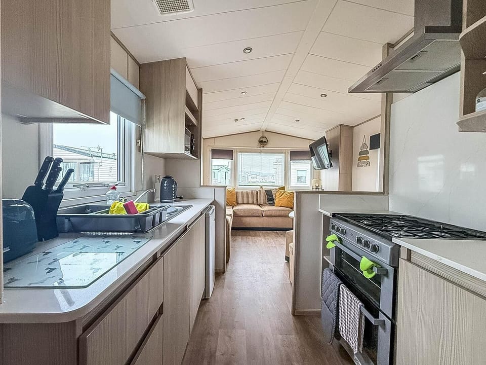 Bright, modern kitchen with cozy living area view