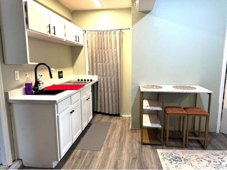 - Kitchen four-burner stove 
- Farmer sink 
- Pantry for storage