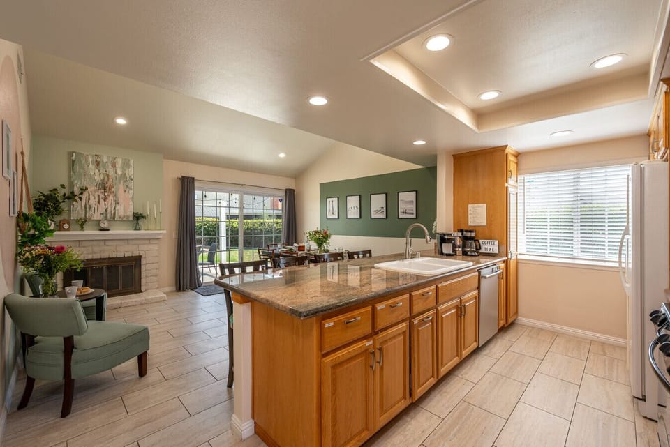 Cook, dine, and relax in this open-concept space that brings everyone together under one warm roof.
