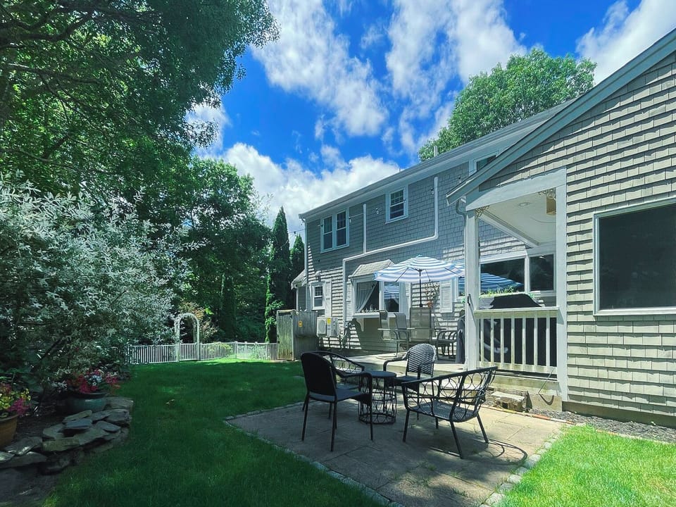 Relax in the Spacious, Sunlit Grassy Fenced Backyard 