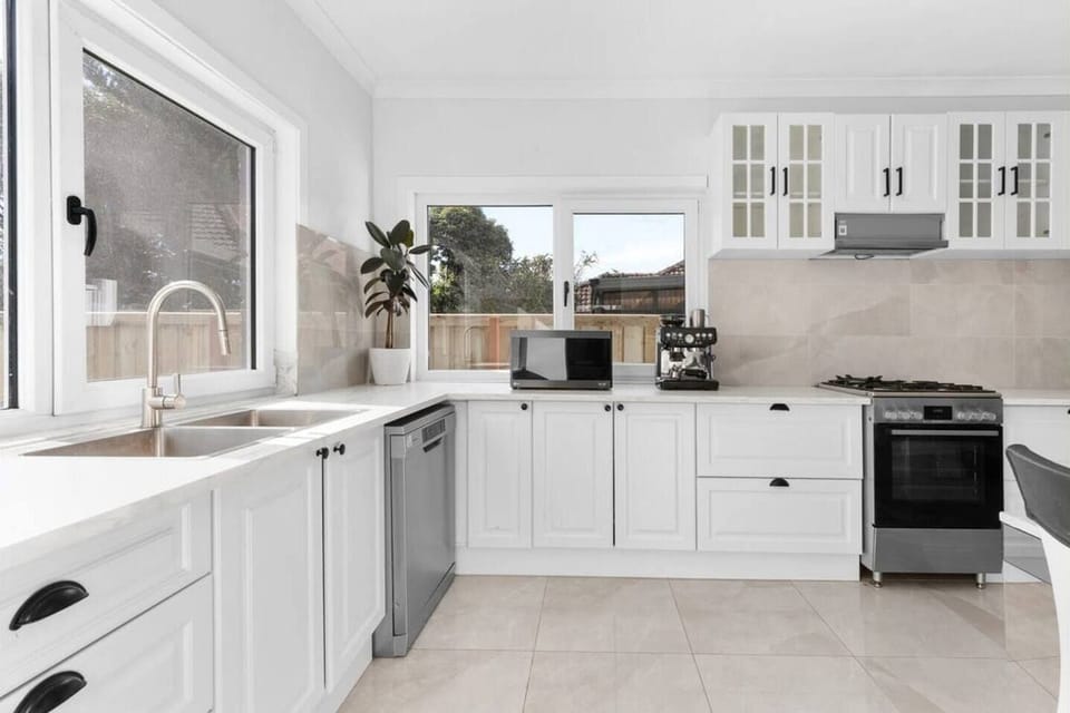 Kitchen with microwave, stove and dishwasher. 