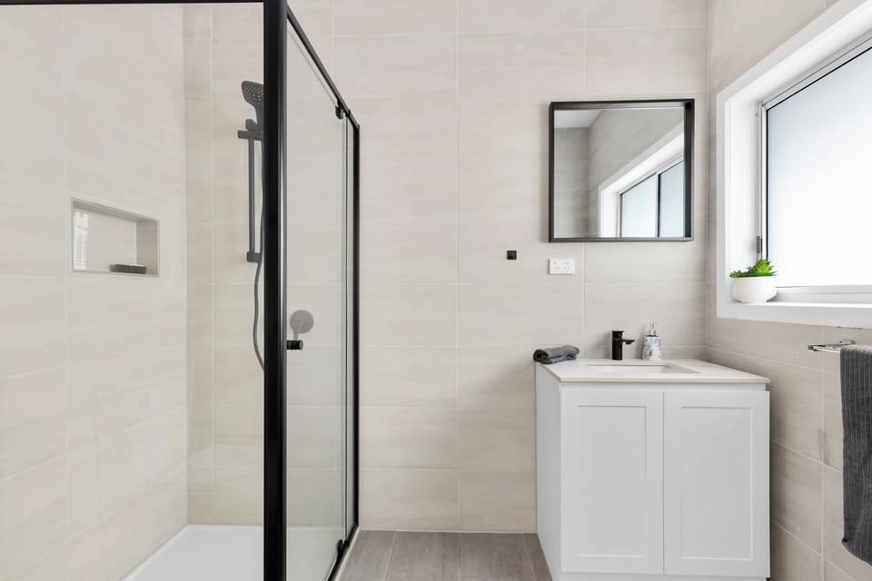 Private bathroom with shower, toilet and vanity. Access from bedroom internally.