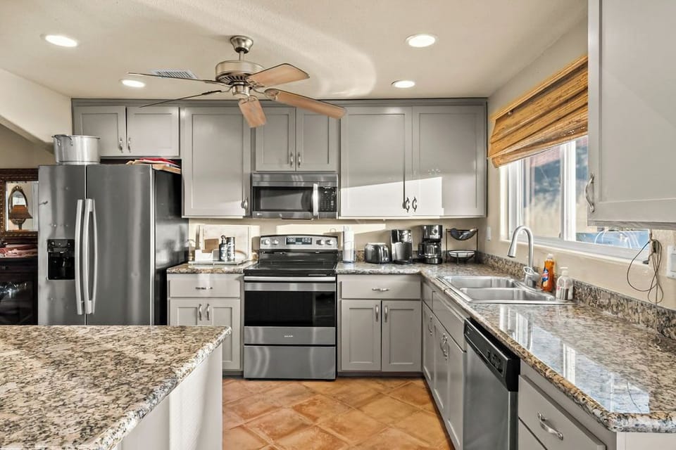 Chef’s kitchen stocked with premium appliances, cookware, and everything you need to cook with ease.