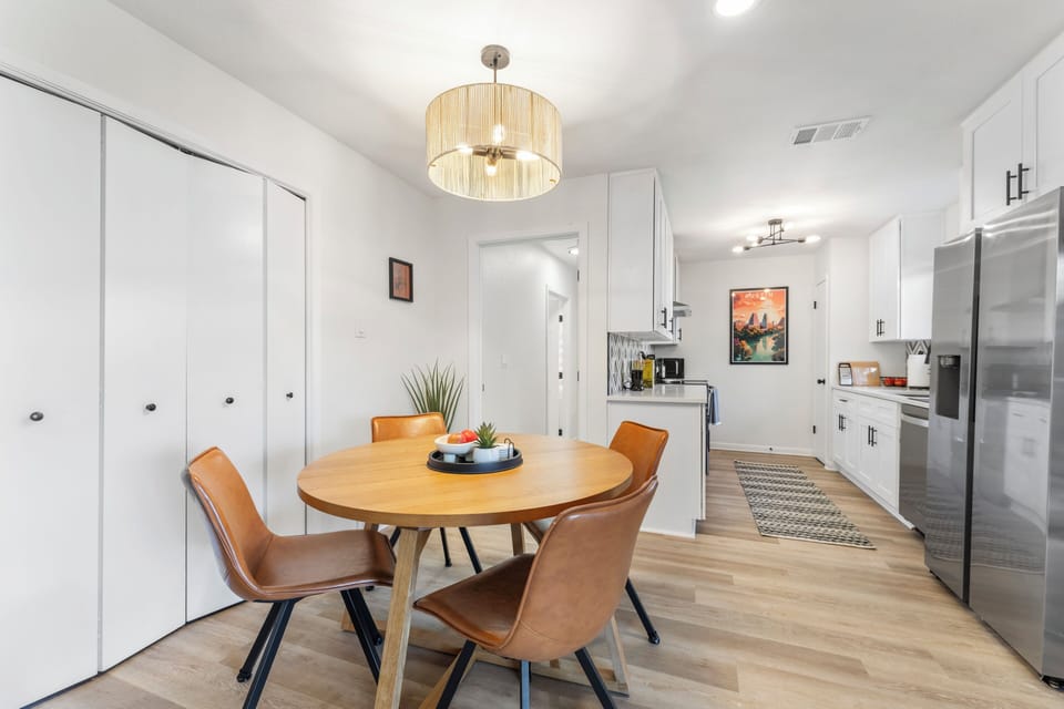 Table expands to fit 6 (2 chairs are tucked away in the closet).