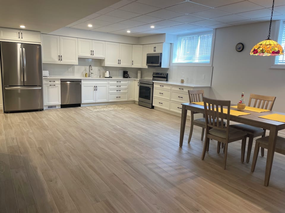 Full size kitchen with stove, oven, microwave, fridge/ freezer and dishwasher. 