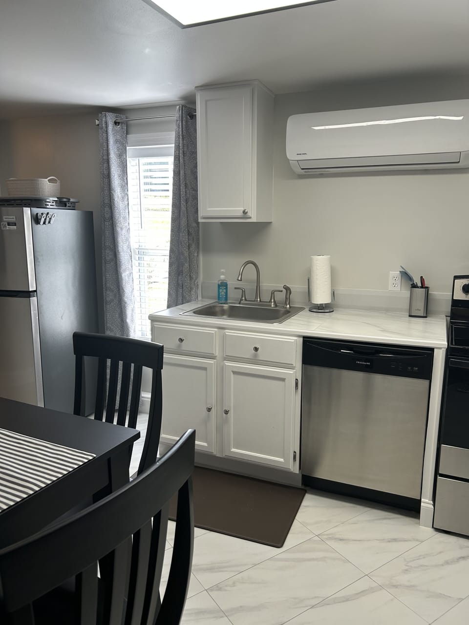 Eat in kitchen with full size appliances and also full size washer/dryer