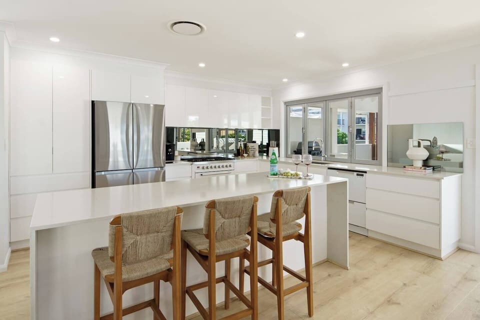 Make use of the fully-equipped kitchen offering a central island, double-door fridge and stainless steel appliances. A dishwasher ensures easy clean up.